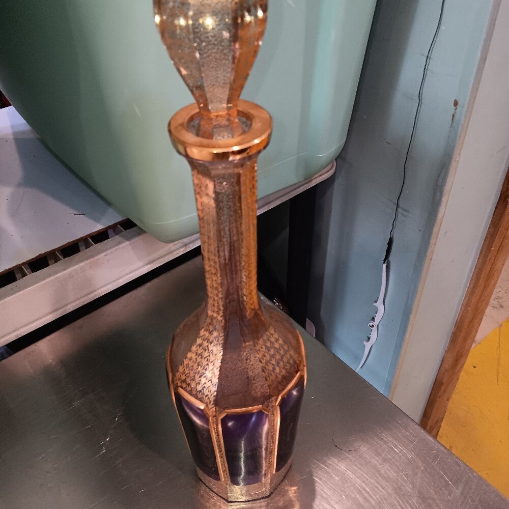 17" tall gold/purple decanter with a top made in West Germany